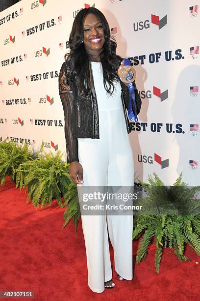 Aja Evans walks the red carpet during the U.S. Olympic Committee's Best of U.S. Awards at Warner Theatre on April 2, 2014 in Washington, DC.