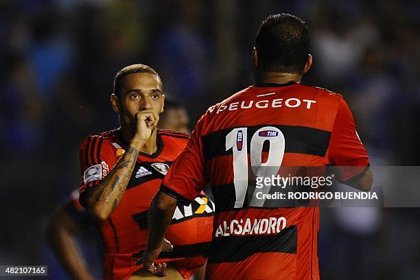 Flamengo's Paulinho celebrates with teammates after scoring against Emelec from Ecuador during their 2014 Copa Libertadores football match at George...