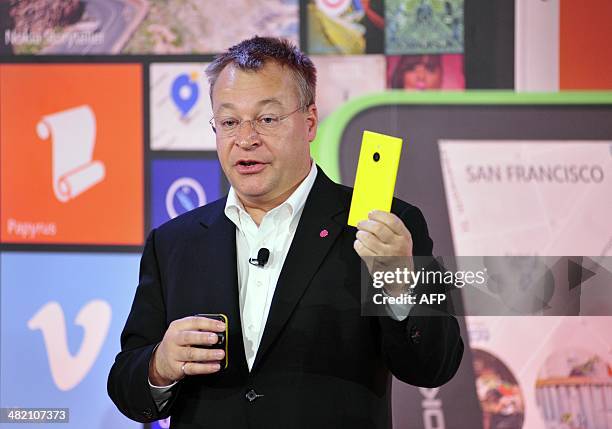 Stephen Elop, Executive Vice President of Devices and Services for Nokia, holds up a Nokia Lumia 1520 during More Lumia, a media event in San...