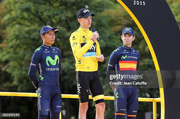 Winner of the Tour Chris Froome of Great Britain and Team Sky wearing the yellow jersey is surrounded by second placed Nairo Quintana of Colombia and...