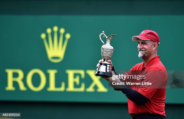 Marco Dawson of the USA poses with the trophy after winning The Senior Open Championship on the Old Course at Sunningdale Golf Club on July 26, 2015...