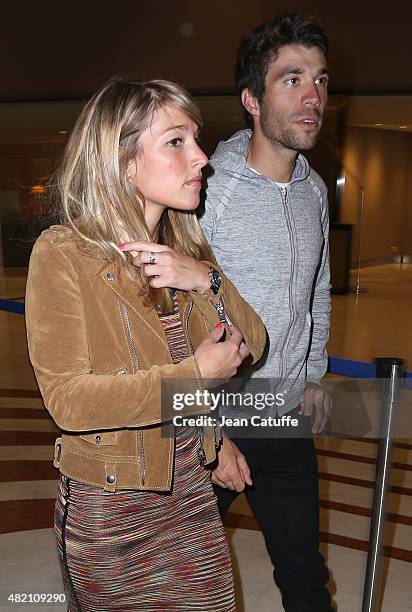 Thibaut Pinot of France and Team FDJ and his girlfriend leave their hotel for the team's party, following stage twenty one of the 2015 Tour de...