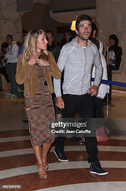 Thibaut Pinot of France and Team FDJ and his girlfriend leave their hotel for the team's party, following stage twenty one of the 2015 Tour de...