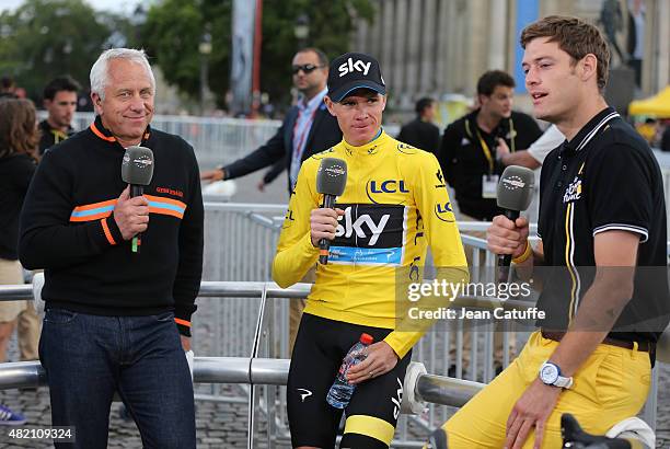 Winner of the Tour Chris Froome of Great Britain and Team Sky is interviewed by three time winner of the Tour de France Greg Lemond and Ashley House...