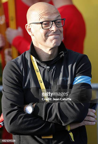 Dave Brailsford, manager of Team Sky looks on during the trophy ceremony, following stage twenty one of the 2015 Tour de France, a 109.5 km stage...