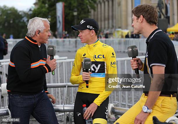 Winner of the Tour Chris Froome of Great Britain and Team Sky is interviewed by three time winner of the Tour de France Greg Lemond and Ashley House...