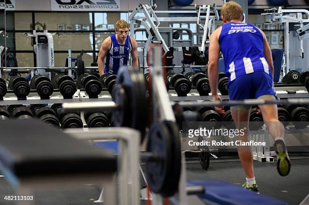 Jack Ziebell of the Kangaroos works out in the gym during a North Melbourne Kangaroos AFL training session at Arden Street Ground on April 3, 2014 in...