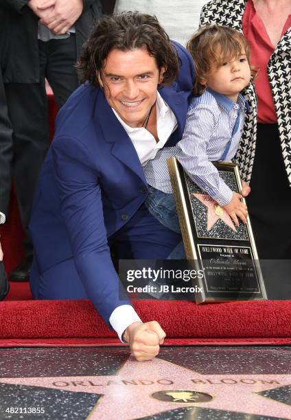 Orlando Bloom and his son Flynn Bloom attend the Hollywood Walk of Fame celebration in honor of Orlando Bloom on April 2, 2014 in Hollywood,...