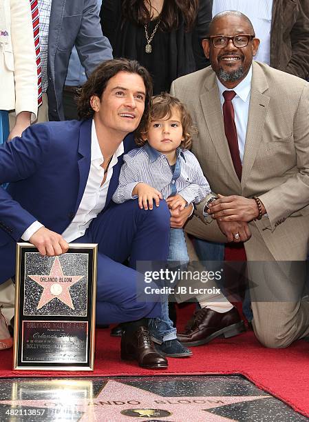Orlando Bloom, his son Flynn Bloom and Forest Whitaker attend the Hollywood Walk of Fame celebration in honor of Orlando Bloom on April 2, 2014 in...