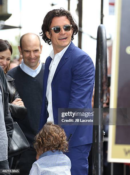 Orlando Bloom and his son Flynn Bloom attend the Hollywood Walk of Fame celebration in honor of Orlando Bloom on April 2, 2014 in Hollywood,...