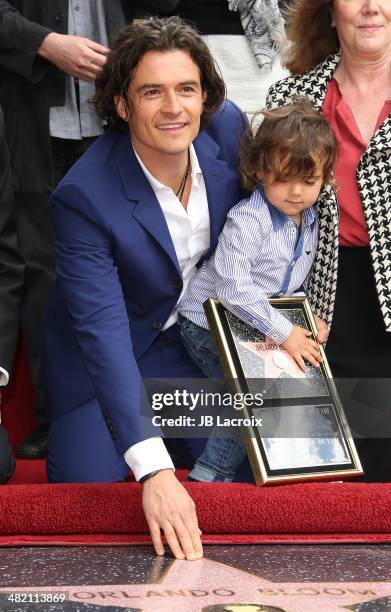 Orlando Bloom and his son Flynn Bloom attend the Hollywood Walk of Fame celebration in honor of Orlando Bloom on April 2, 2014 in Hollywood,...