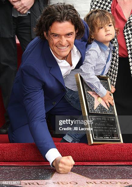 Orlando Bloom and his son Flynn Bloom attend the Hollywood Walk of Fame celebration in honor of Orlando Bloom on April 2, 2014 in Hollywood,...