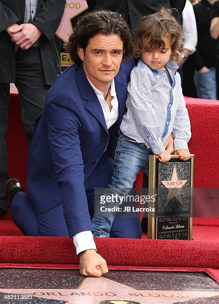 Orlando Bloom and his son Flynn Bloom attend the Hollywood Walk of Fame celebration in honor of Orlando Bloom on April 2, 2014 in Hollywood,...