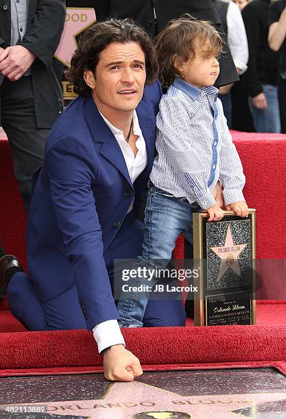 Orlando Bloom and his son Flynn Bloom attend the Hollywood Walk of Fame celebration in honor of Orlando Bloom on April 2, 2014 in Hollywood,...