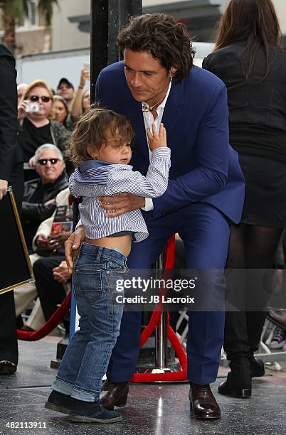 Orlando Bloom and his son Flynn Bloom attend the Hollywood Walk of Fame celebration in honor of Orlando Bloom on April 2, 2014 in Hollywood,...