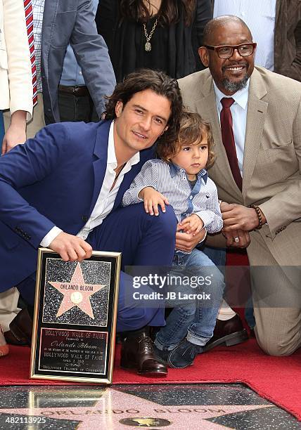 Orlando Bloom, his son Flynn Bloom and Forest Whitaker attend the Hollywood Walk of Fame celebration in honor of Orlando Bloom on April 2, 2014 in...
