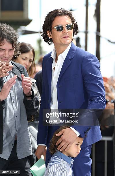 Orlando Bloom and his son Flynn Bloom attend the Hollywood Walk of Fame celebration in honor of Orlando Bloom on April 2, 2014 in Hollywood,...