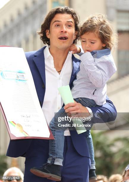 Orlando Bloom and his son Flynn Bloom attend the Hollywood Walk of Fame celebration in honor of Orlando Bloom on April 2, 2014 in Hollywood,...