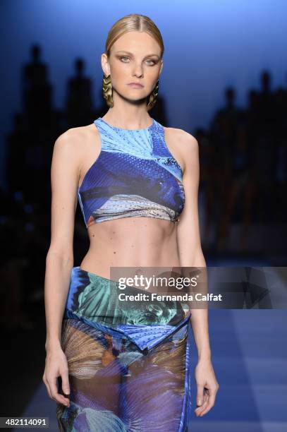 Carol Trentini walks the runway during the Agua de Coco por Liana Thomaz show at Sao Paulo Fashion Week Summer 2014/2015 at Parque Candido Portinari...