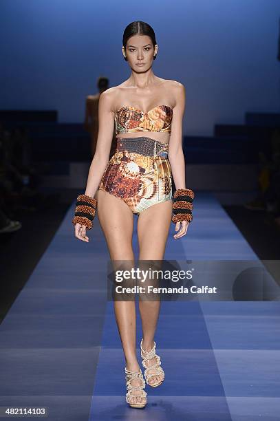 Juliana Imai walks the runway during the Agua de Coco por Liana Thomaz show at Sao Paulo Fashion Week Summer 2014/2015 at Parque Candido Portinari on...