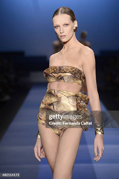 Regina Krilow walks the runway during the Agua de Coco por Liana Thomaz show at Sao Paulo Fashion Week Summer 2014/2015 at Parque Candido Portinari...