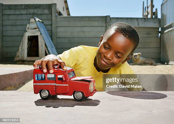 boy playing with a handmade toy car - jouet garçon photos et images de collection