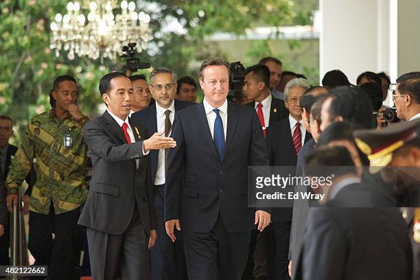 Indonesian President Joko Widodo introduces British Prime Minister David Cameron to Indonesian business and government leaders before bi-lateral...