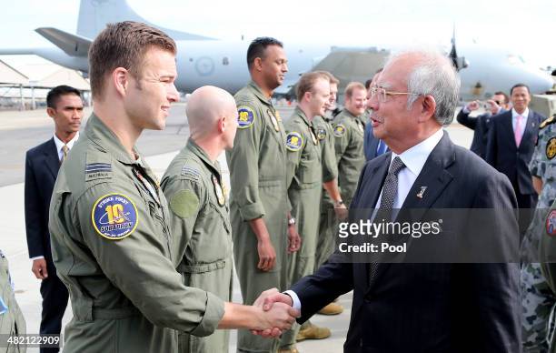 Malaysia Prime Minister Najib Razak meets with a RAAF P3 Orion captain Lieutenant Russell Adams and his crew involved in the search for wreckage and...