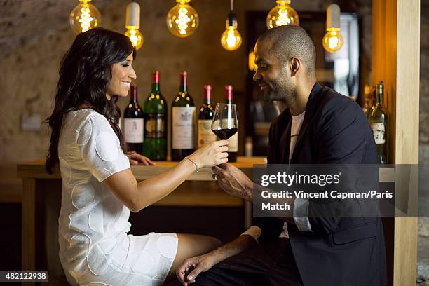 Tony Parker with his wife Axelle Francine and their son Josh are photographed for Paris Match in their new property on july 15, 2015 in near...