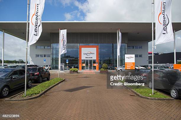 Banners fly outside a LeasePlan Corp. Used car leasing and contract automobile hire showroom in Breukelen, Netherlands, on Monday, July 27, 2015....