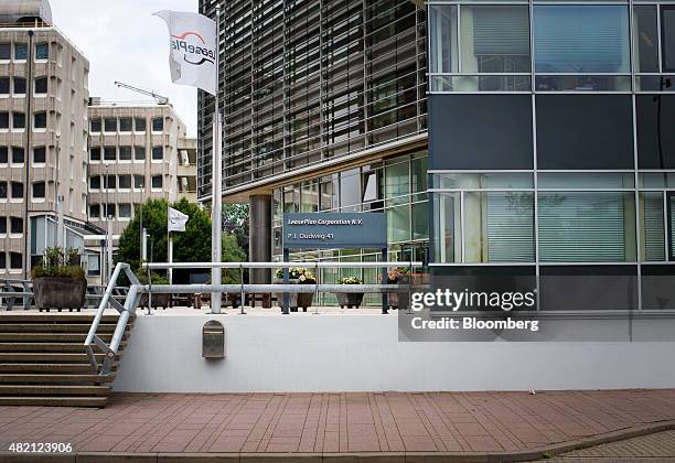 The LeasePlan Corp. Logo sits on a flag flying outside the car leasing and contract automobile hire company's headquarters in Almere, Netherlands, on...