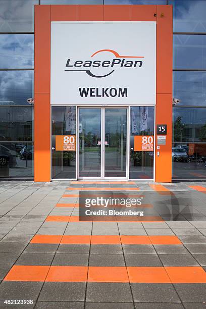 The LeasePlan Corp. Logo sits above the entrance to a used car leasing and contract automobile hire showroom in Breukelen, Netherlands, on Monday,...