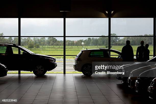 Customers browse automobiles inside a LeasePlan Corp. Used car leasing and contract hire showroom in Breukelen, Netherlands, on Monday, July 27,...