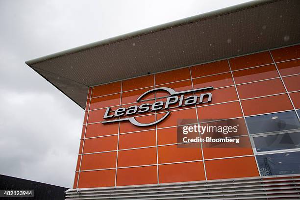 The LeasePlan Corp. Logo sits on the exterior of the company's used automobile leasing and contract car hire showroom in Breukelen, Netherlands, on...