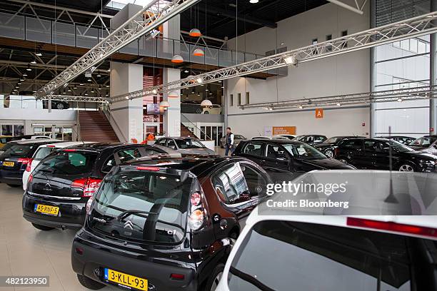 Automobiles sit inside a LeasePlan Corp. Used car leasing and contract hire showroom in Breukelen, Netherlands, on Monday, July 27, 2015. Volkswagen...