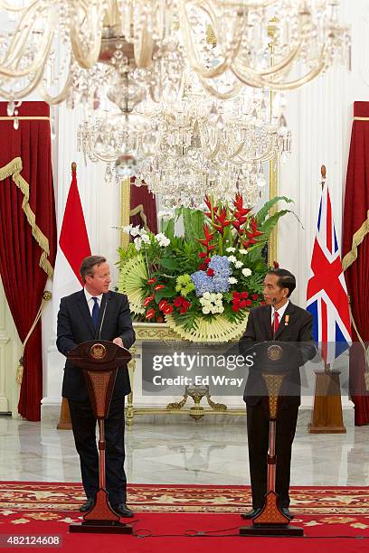 British Prime Minister David Cameron and Indonesian President Joko Widodo, speak at a joint briefing after the signing of several memorandums of...