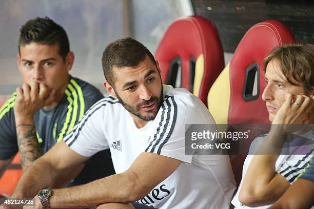 Karim Benzema and Luka Modric of Real Madrid sit on the bench during the International Champions Cup football match between Inter Milan and Real...