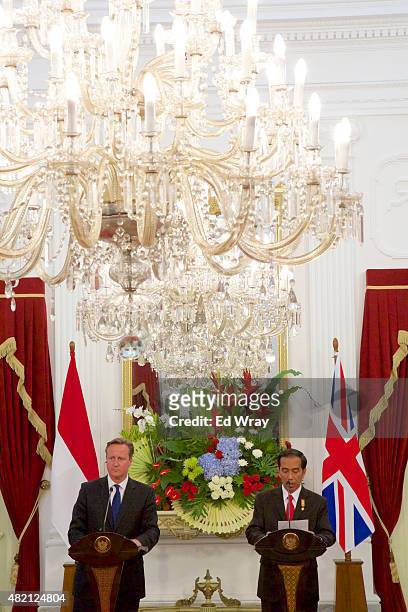 British Prime Minister David Cameron and Indonesian President Joko Widodo, speak at a joint briefing after the signing of several memorandums of...