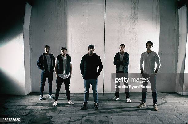 Pat Cummins, Peter Siddle, Mitchell Johnson, Josh Hazlewood and Mitchell Starc of Australia pose during an Australian Fast Bowlers Portrait Session...