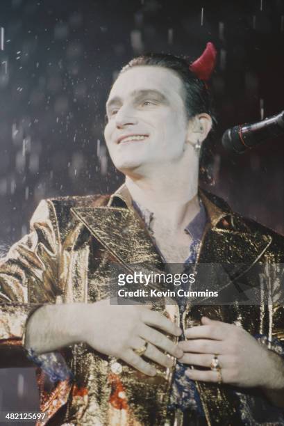 Singer Bono, in his stage persona of Mr MacPhisto, during a concert by Irish rock group U2 on their 'Zoo TV' tour, USA, 1992.