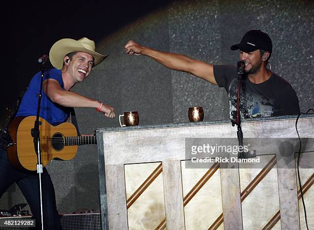 Singer/Songwriter Luke Bryan is joined onstage by Dustin Lynch at Country Thunder - Day 4 In Twin Lakes, Wisconsin on July 26, 2015 in Twin Lakes,...