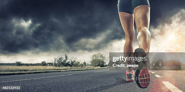 rear view of runners legs - female soles stockfoto's en -beelden