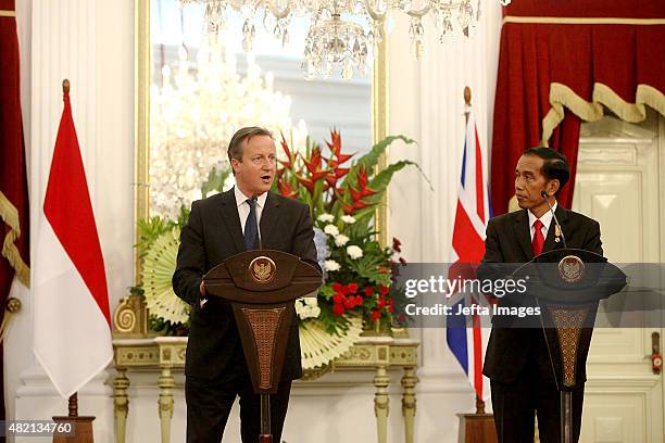British Prime Minister David Cameron and Indonesian President Joko Widodo, deliver a joint briefing after the signing of several memorandums of...