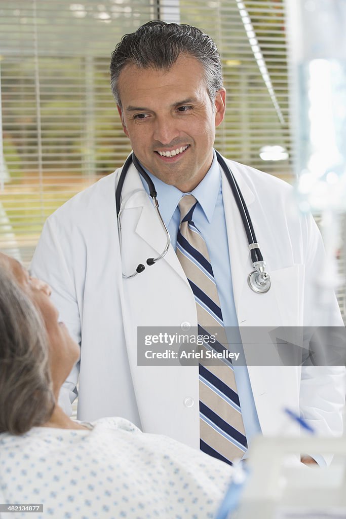 Doctor talking to patient in hospital