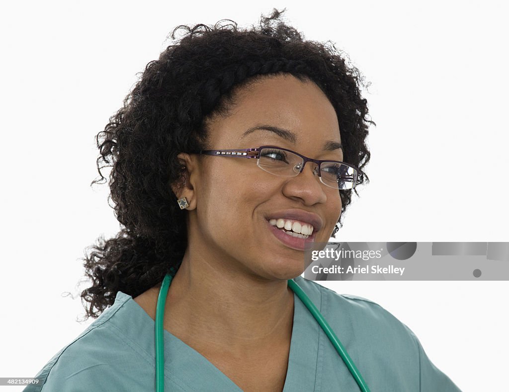 Black nurse smiling in hospital