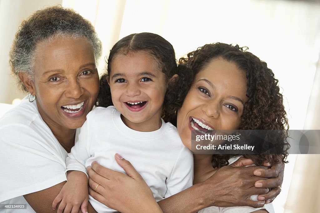 Three generations of women smiling together