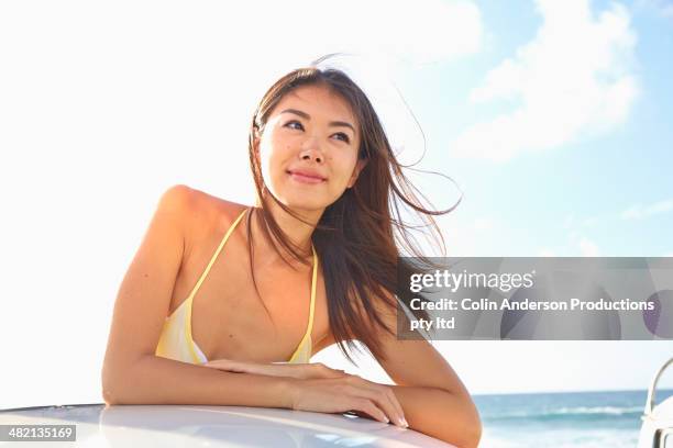 woman smiling outdoors - asian on beach stock pictures, royalty-free photos & images