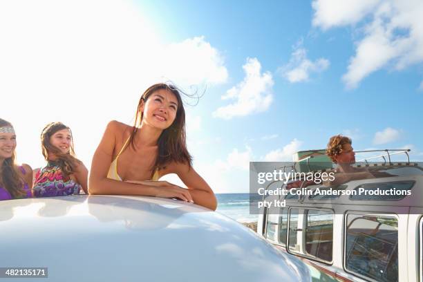 women standing in van on beach - japanese girls hot fotografías e imágenes de stock