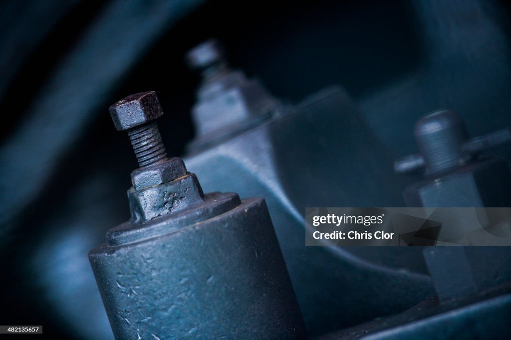 Close up of nuts and bolts on machinery