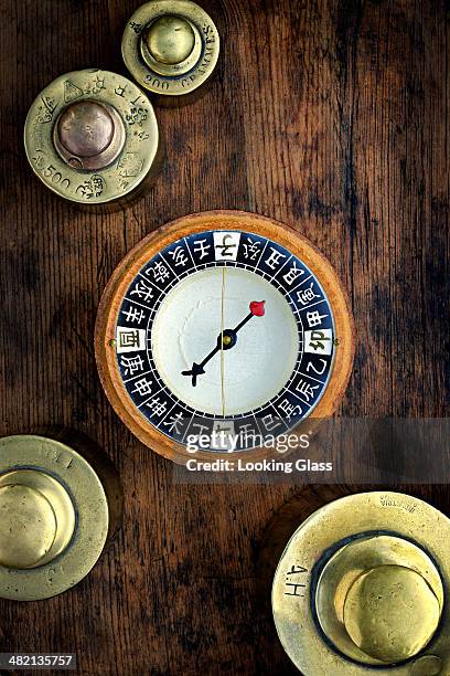 close up of chinese compass and gold weights - chinese language stock pictures, royalty-free photos & images